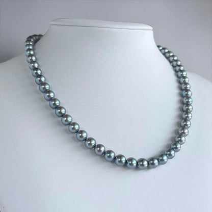 Swanklassup Tasaki Akoya natural blue pearl necklace with 7.5mm pearls displayed on white background