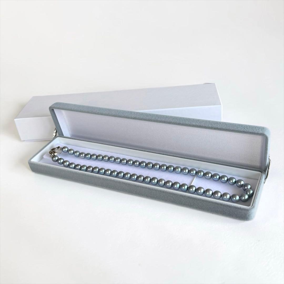 Swanklassup Tasaki Akoya natural blue pearl necklace with 7.5mm pearls displayed on white background