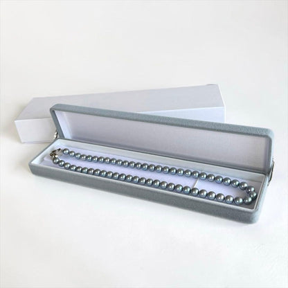 Swanklassup Tasaki Akoya natural blue pearl necklace with 7.5mm pearls displayed on white background