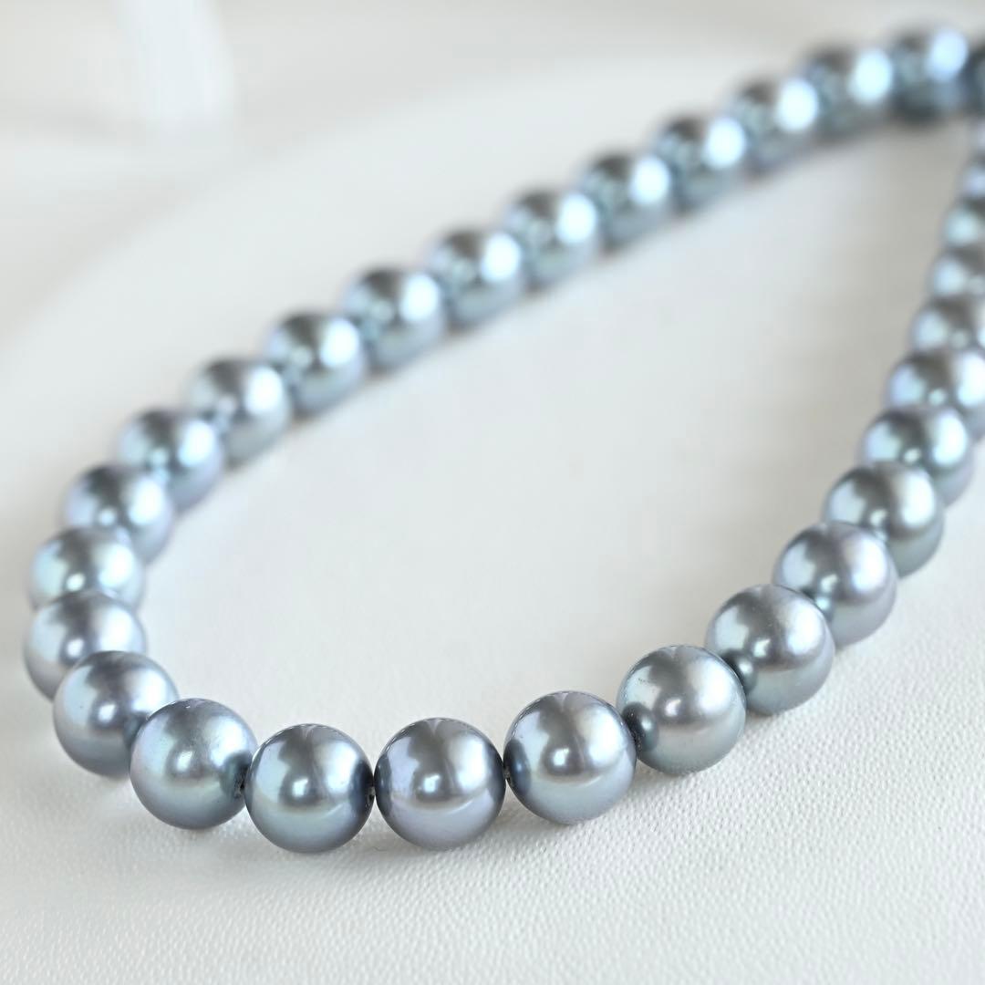 Swanklassup Tasaki Akoya natural blue pearl necklace with 7.5mm pearls displayed on white background