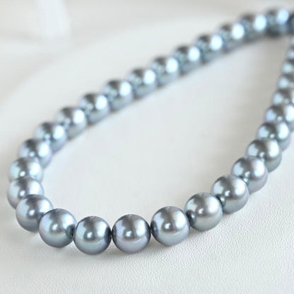 Swanklassup Tasaki Akoya natural blue pearl necklace with 7.5mm pearls displayed on white background