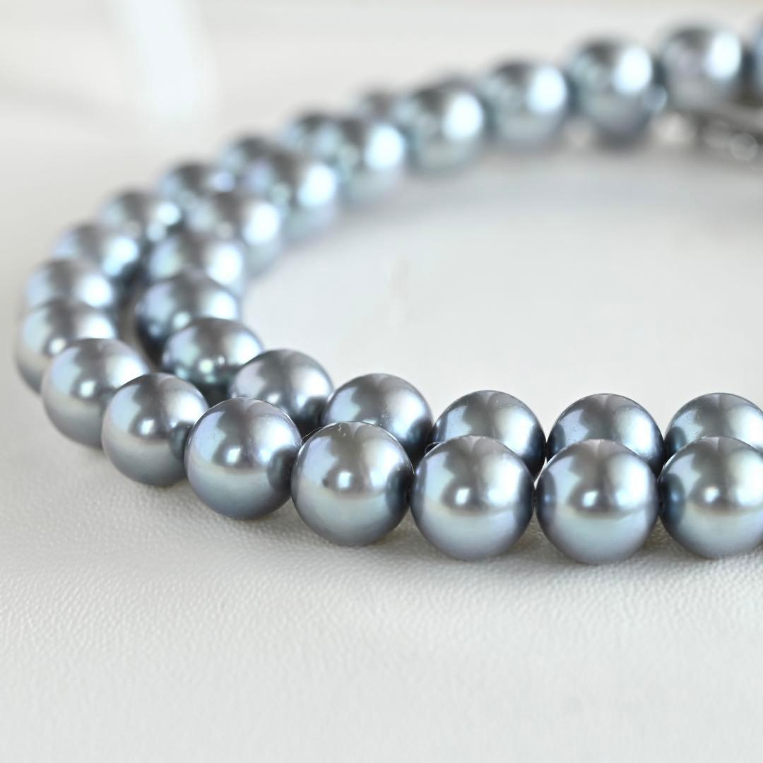 Swanklassup Tasaki Akoya natural blue pearl necklace with 7.5mm pearls displayed on white background