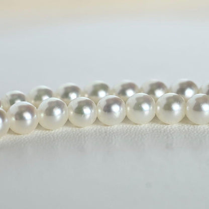 Mikimoto Akoya pearl necklace with round baby pearls on 18-karat yellow gold chain, 36cm length