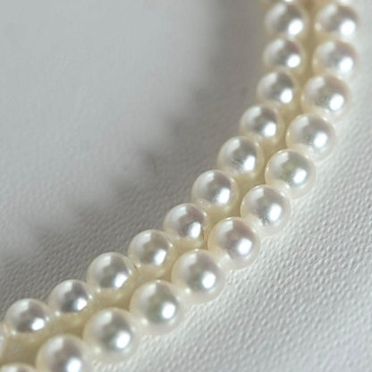 Mikimoto Akoya pearl necklace with round baby pearls on 18-karat yellow gold chain, 36cm length