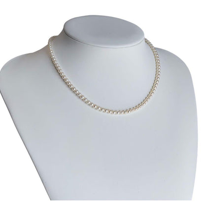 Mikimoto Akoya pearl necklace with round baby pearls on 18-karat yellow gold chain, 36cm length