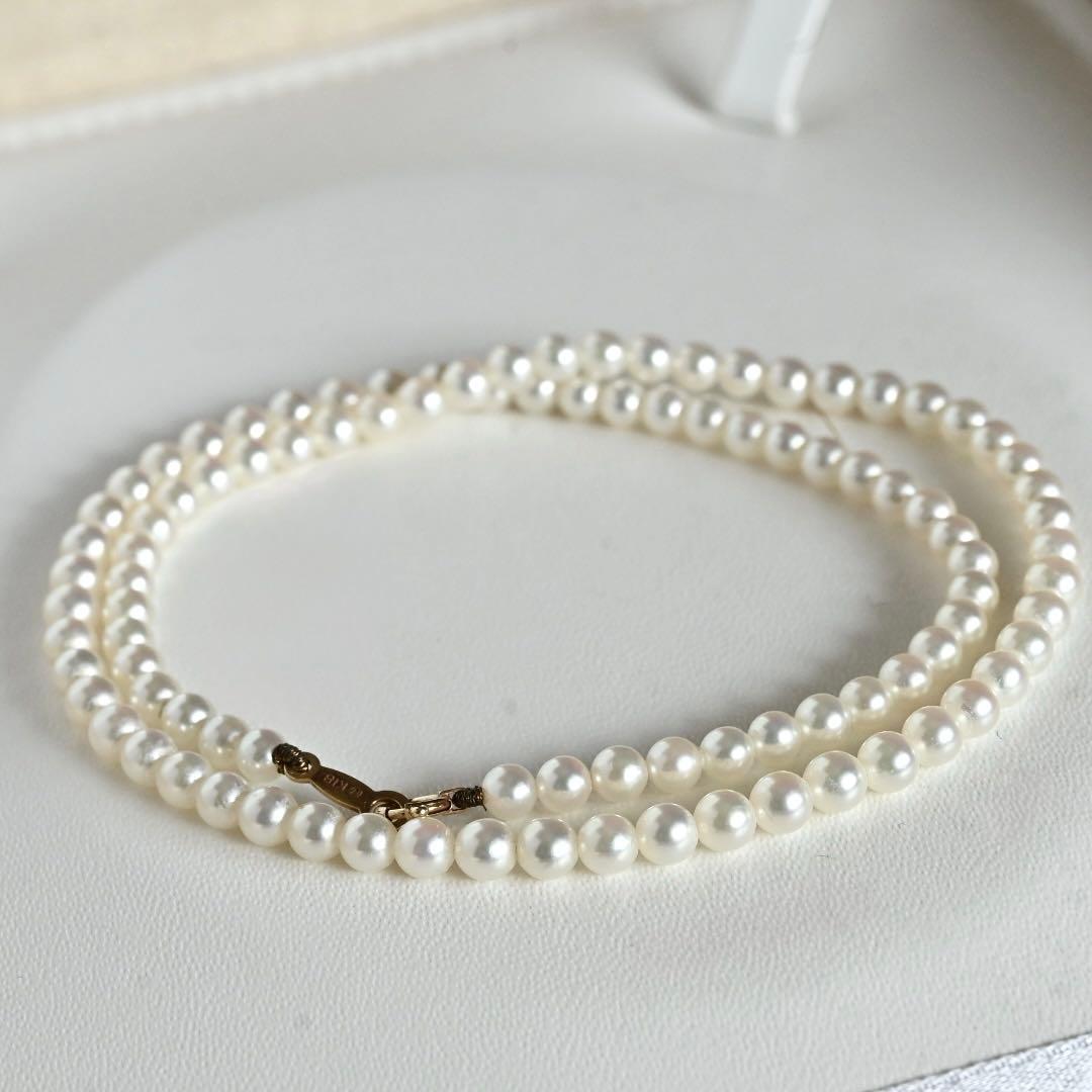 Mikimoto Akoya pearl necklace with round baby pearls on 18-karat yellow gold chain, 36cm length
