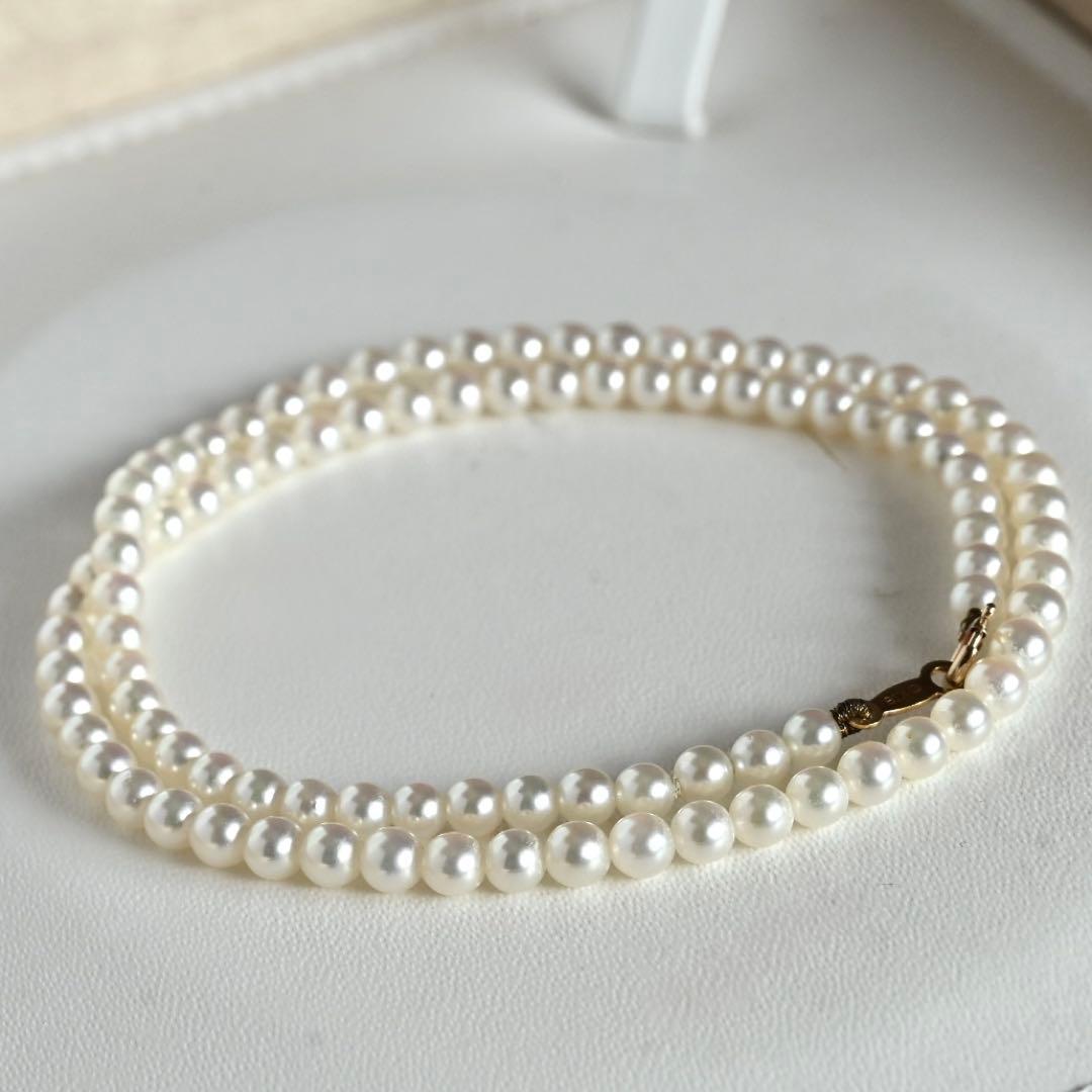 Mikimoto Akoya pearl necklace with round baby pearls on 18-karat yellow gold chain, 36cm length