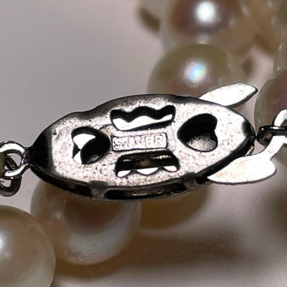 Akoya pearl necklace with 7.0 to 7.5 mm round white pearls, 37.8 cm length, featuring silver imprint