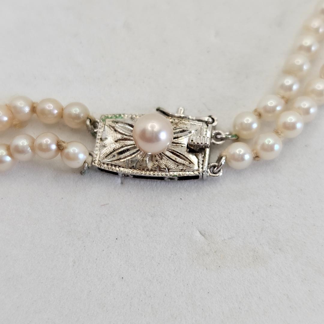 Akoya pearl two-strand gradient necklace with silver clasp, 43cm length displayed on white background