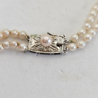 Akoya pearl two-strand gradient necklace with silver clasp, 43cm length displayed on white background