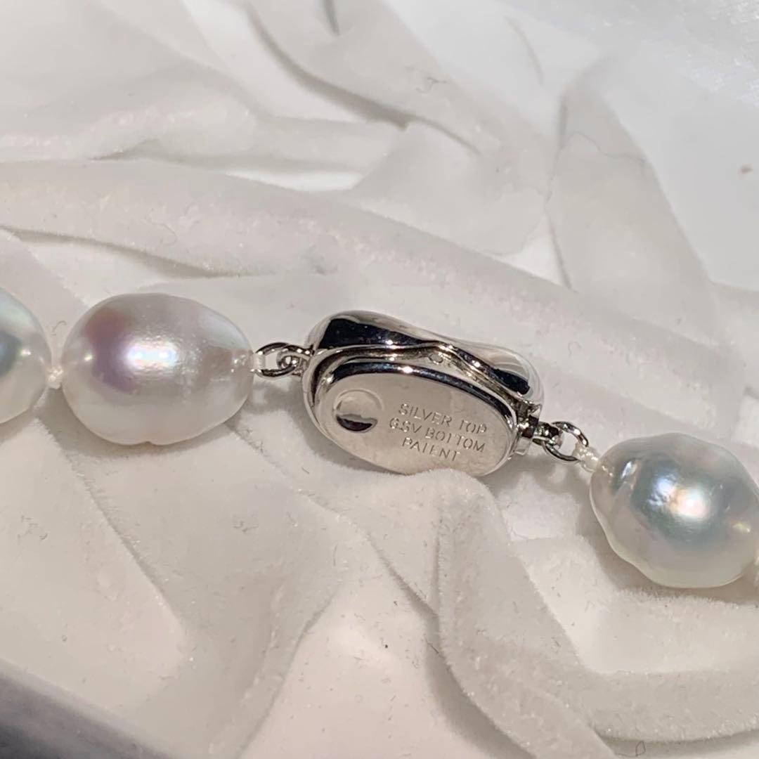 White butterfly pearl necklace with 9-12mm pearls and a silver clasp displayed on a white background