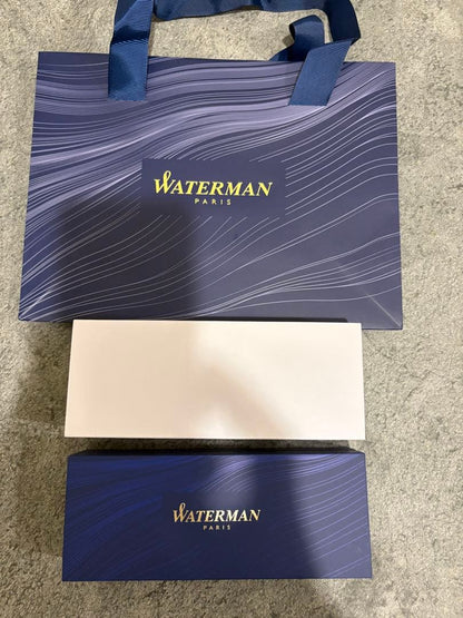 Waterman black and gold ballpoint pen with gold cap, included case and paper bag