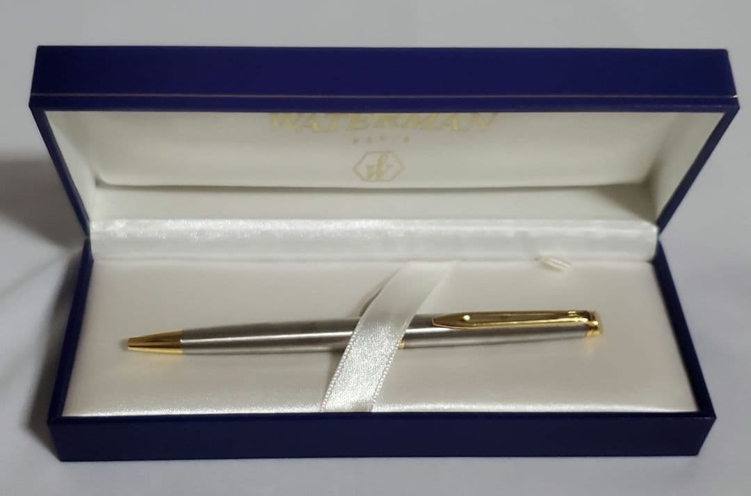 Unused WATERMAN ballpoint pen with original box showing some dirt on cover