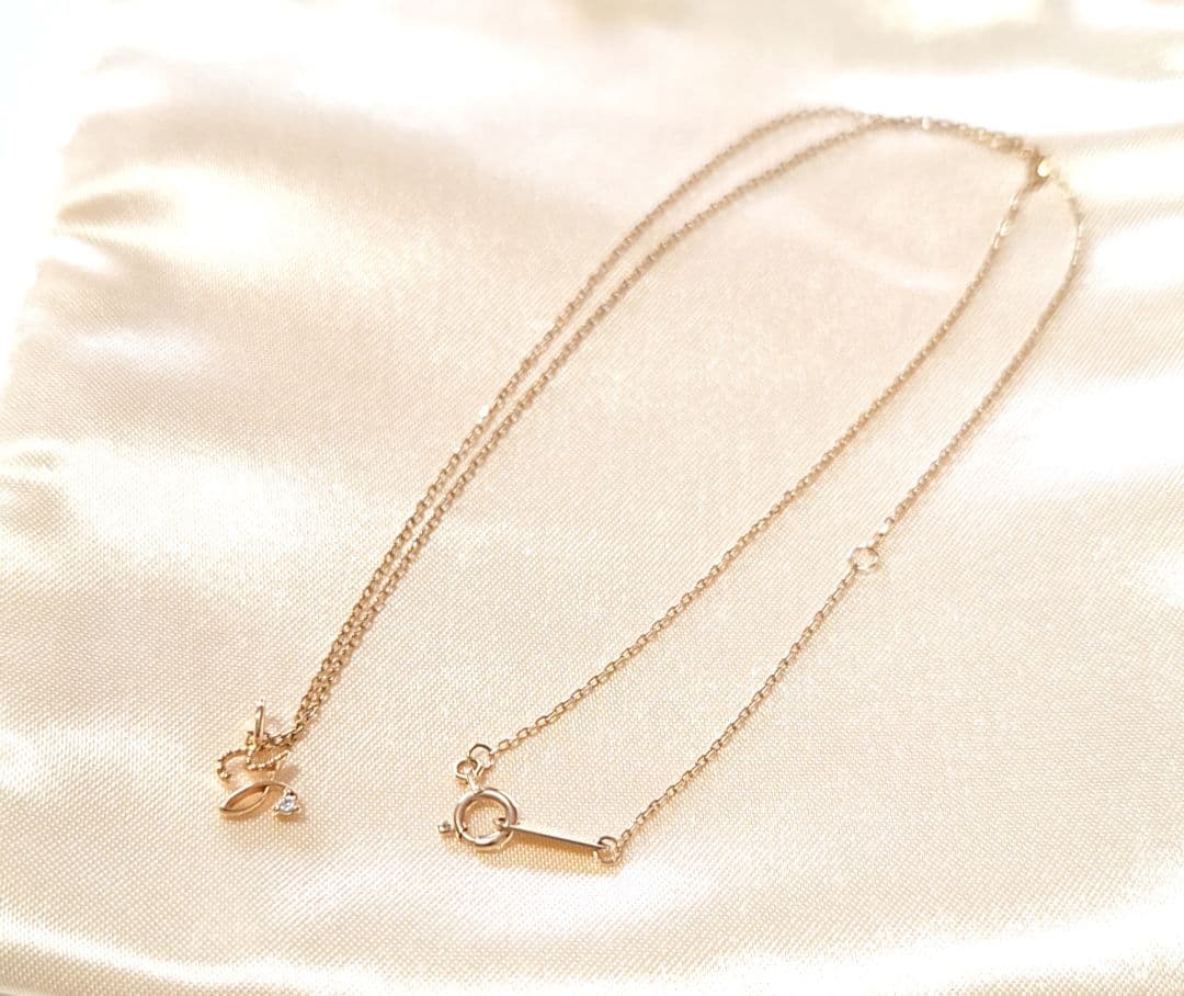 Agete K10 yellow gold necklace with diamond initial Y pendant on a fine chain