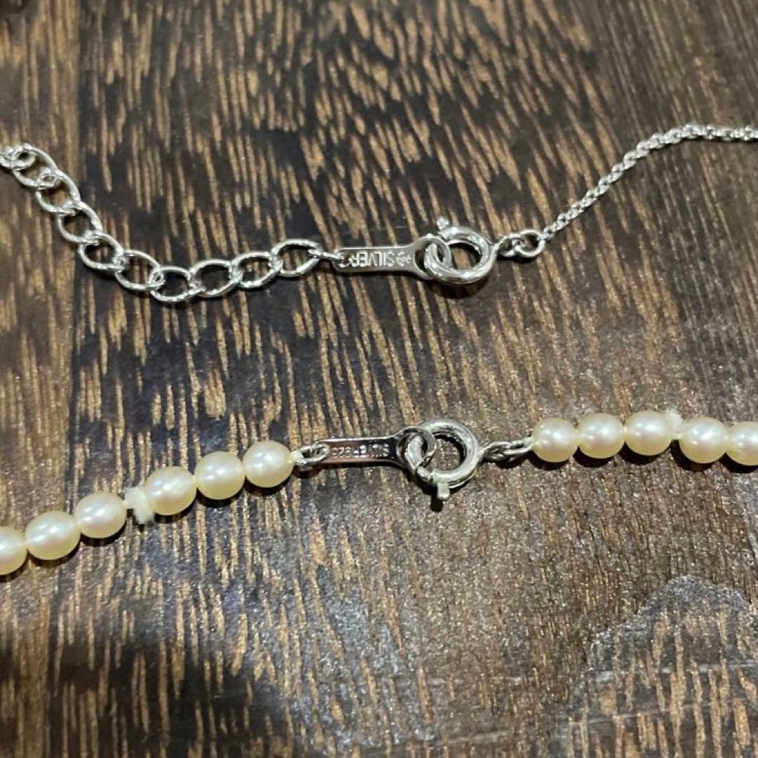 Tasaki Pearl Baby Pearl Necklace Set in silver featuring one-string pearl necklace and adjustable pearl cross necklace chain
