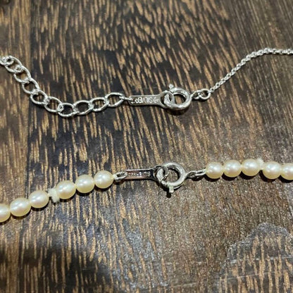 Tasaki Pearl Baby Pearl Necklace Set in silver featuring one-string pearl necklace and adjustable pearl cross necklace chain