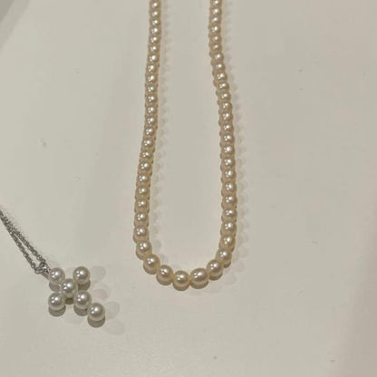 Tasaki Pearl Baby Pearl Necklace Set in silver featuring one-string pearl necklace and adjustable pearl cross necklace chain