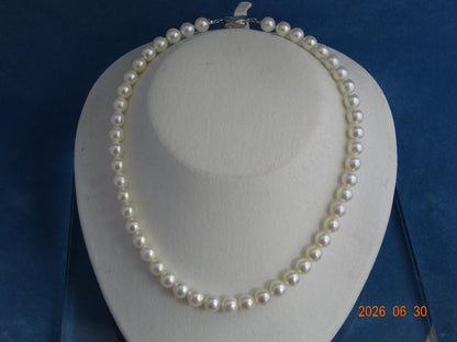Akoya pearl necklace with 8-8.5mm white semi-round pearls showing subtle pink and cream tones