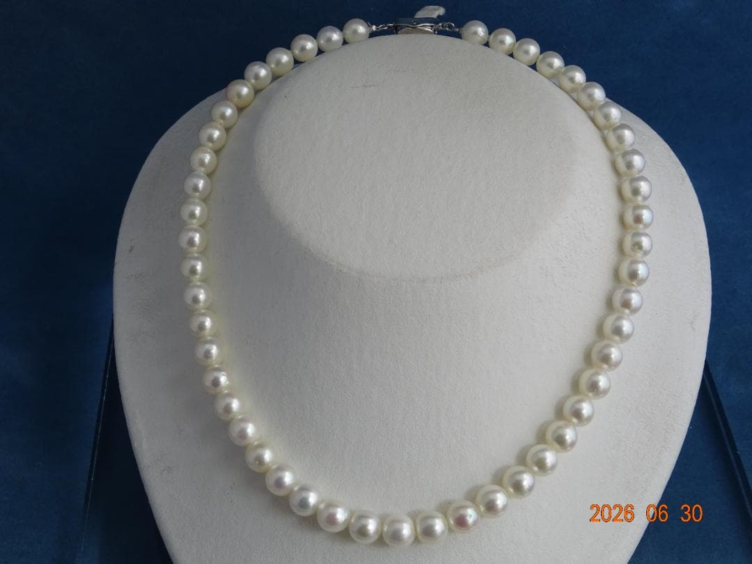 Akoya pearl necklace with 8-8.5mm white semi-round pearls showing subtle pink and cream tones