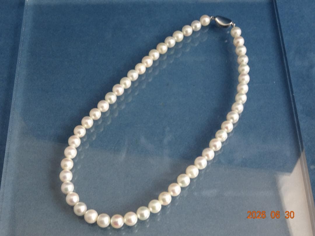 Akoya pearl necklace with 8-8.5mm white semi-round pearls showing subtle pink and cream tones