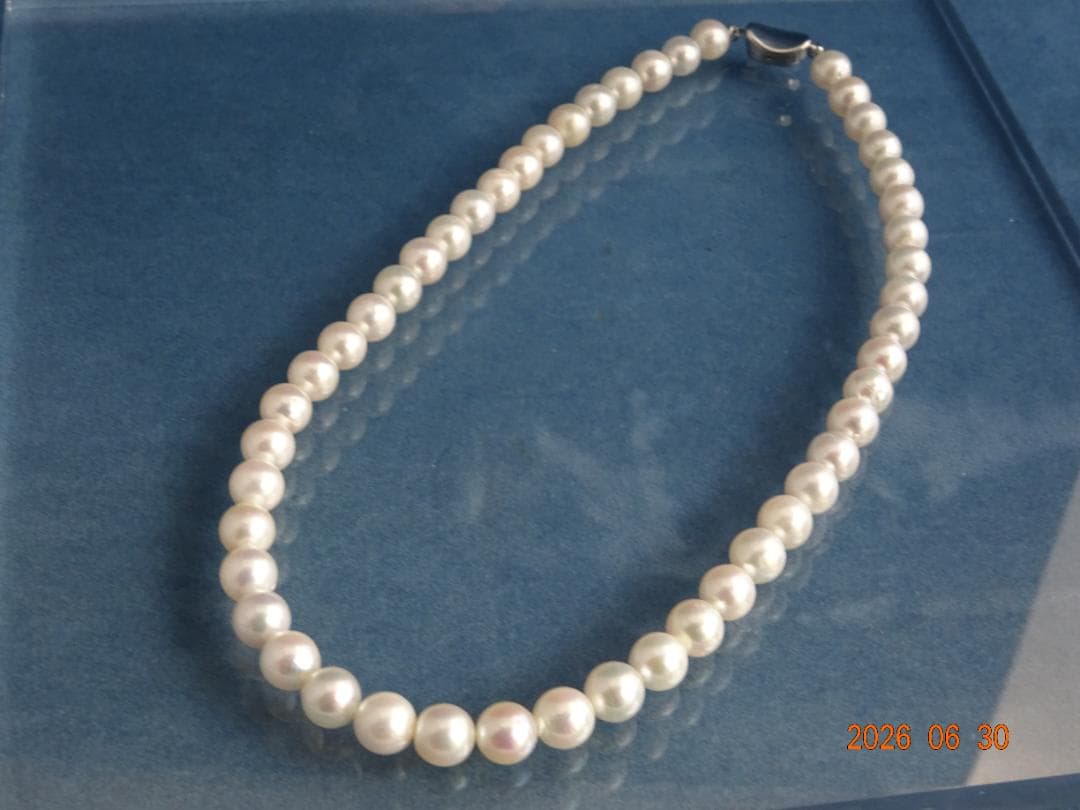 Akoya pearl necklace with 8-8.5mm white semi-round pearls showing subtle pink and cream tones