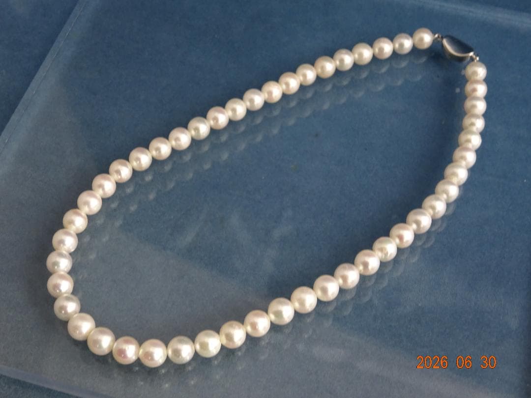 Akoya pearl necklace with 8-8.5mm white semi-round pearls showing subtle pink and cream tones