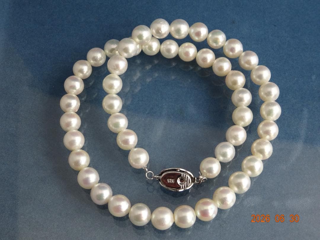 Akoya pearl necklace with 8-8.5mm white semi-round pearls showing subtle pink and cream tones