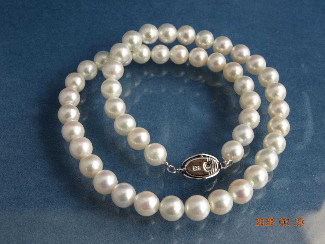 Akoya pearl necklace with 8-8.5mm white semi-round pearls showing subtle pink and cream tones