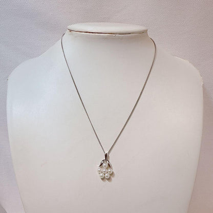 Mikimoto silver necklace featuring six Akoya baby pearls on a 40cm chain