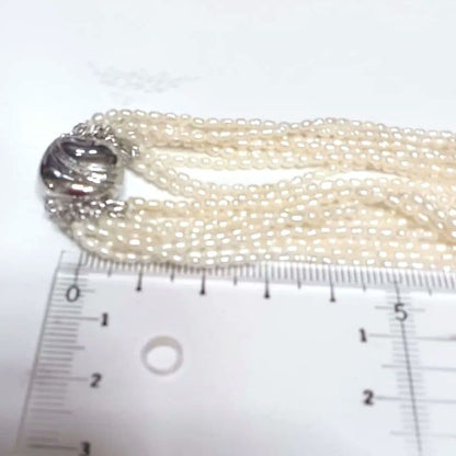 Akoya Keshijima 10-strand pearl long necklace about 81 cm with silver clasp and knotted connection