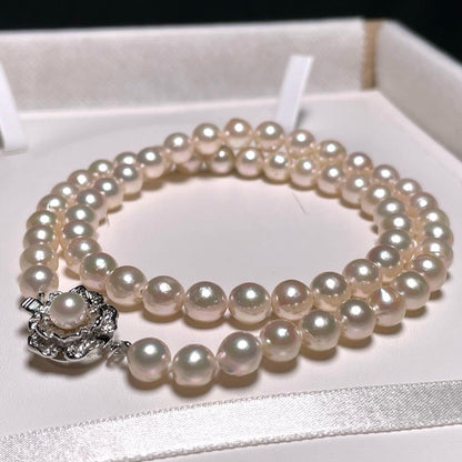 Akoya pearl necklace with 6.4-6.8mm round white pearls on silver chain 44cm length