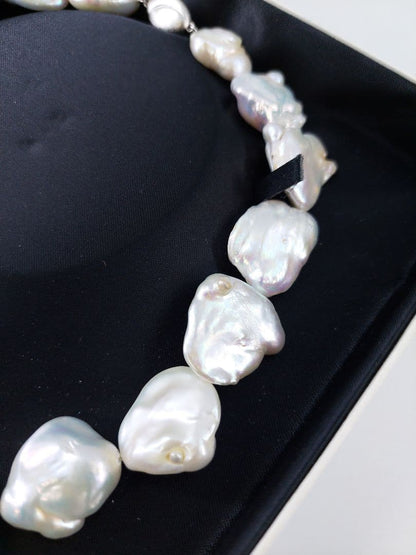 Baroque pearl necklace about 43cm long with natural white untinted pearls sized 18-27mm