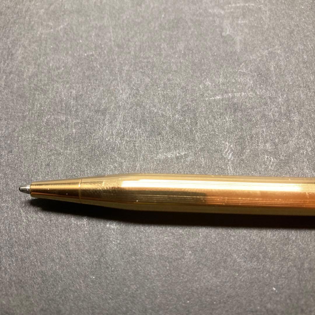 Cross Classic Century gold ballpoint pen in used condition with sleek design