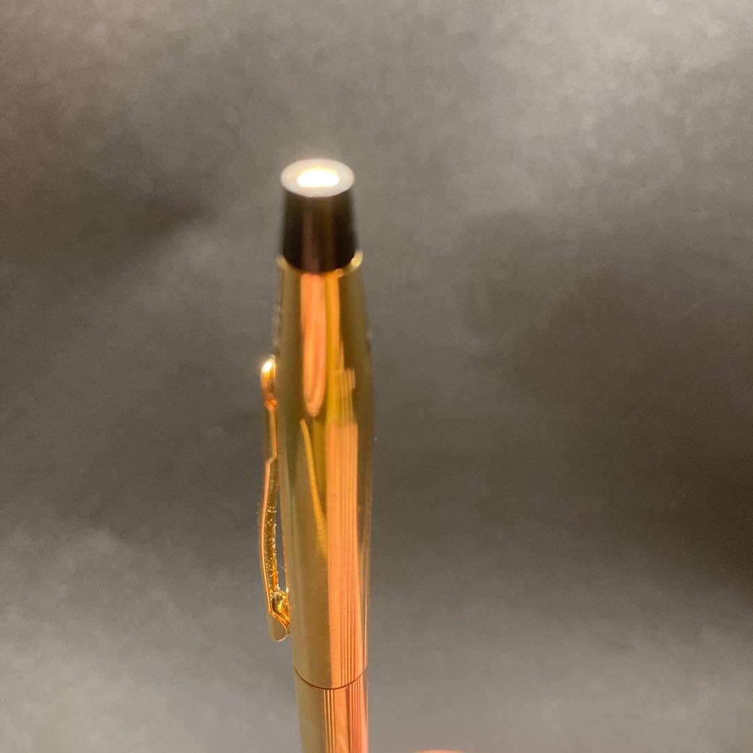 Cross Classic Century gold ballpoint pen in used condition with sleek design