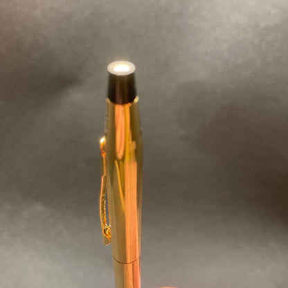 Cross Classic Century gold ballpoint pen in used condition with sleek design