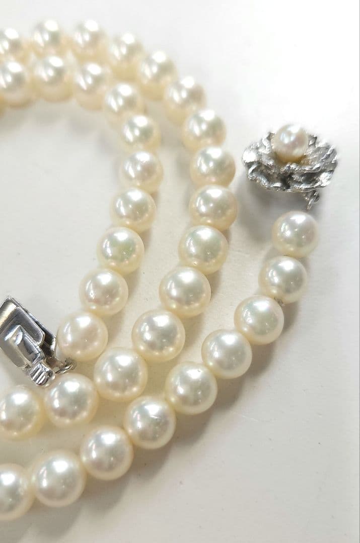 Akoya Pearl Necklace featuring 7 mm white pearl beads, 42 cm length, laid out on a white background