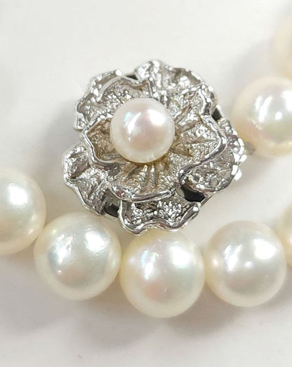 Akoya Pearl Necklace featuring 7 mm white pearl beads, 42 cm length, laid out on a white background