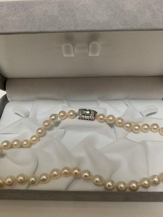 Akoya pearl baroque necklace with 42 pearls, K18WG YG clasp, and a large aquamarine stone