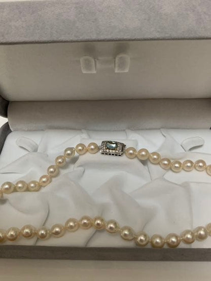 Akoya pearl baroque necklace with 42 pearls, K18WG YG clasp, and a large aquamarine stone