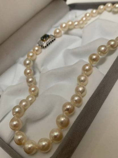 Akoya pearl baroque necklace with 42 pearls, K18WG YG clasp, and a large aquamarine stone