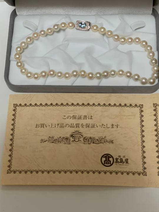 Akoya pearl baroque necklace with 42 pearls, K18WG YG clasp, and a large aquamarine stone