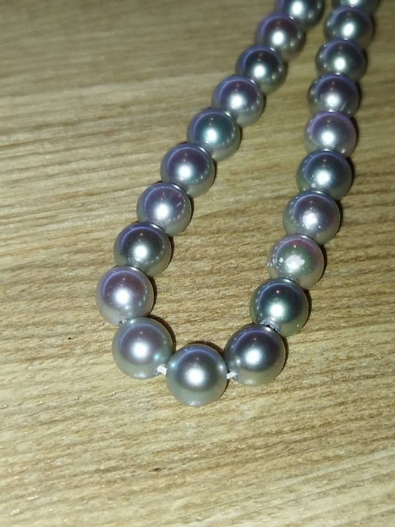 Elegant Akoya pearl necklace featuring lustrous white round pearls on a delicate chain