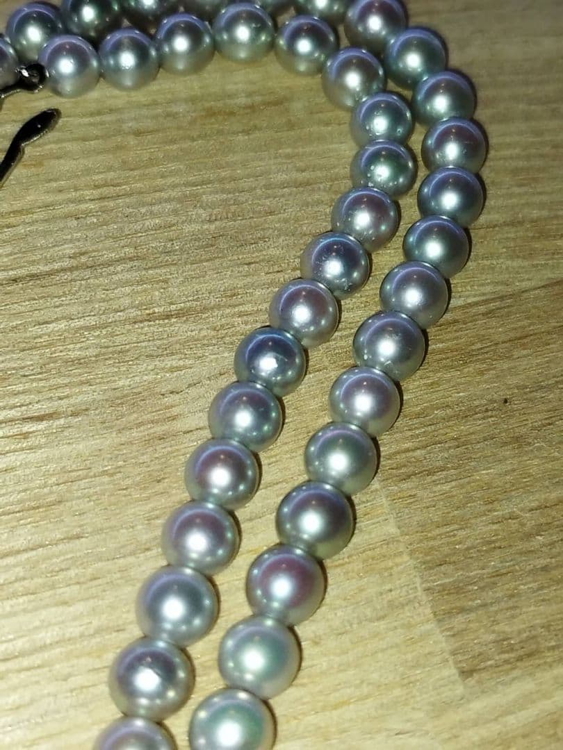 Elegant Akoya pearl necklace featuring lustrous white round pearls on a delicate chain