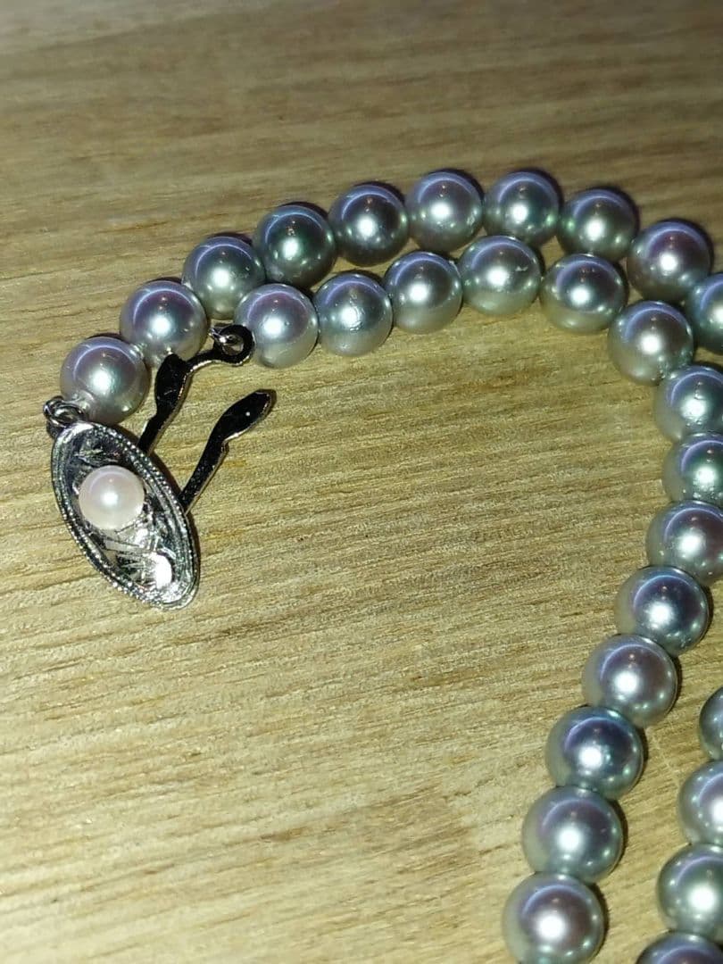 Elegant Akoya pearl necklace featuring lustrous white round pearls on a delicate chain
