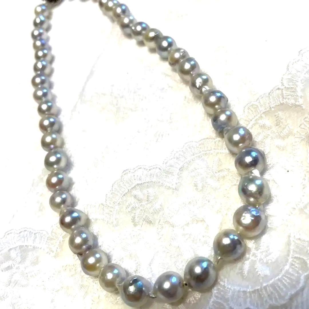 High-quality Akoya baroque pearl in blue-gray color measuring 9.5 to 9 mm with certificate