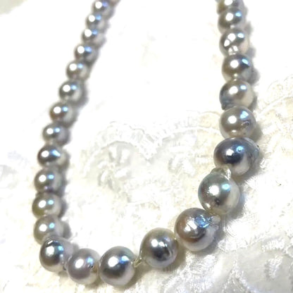 High-quality Akoya baroque pearl in blue-gray color measuring 9.5 to 9 mm with certificate