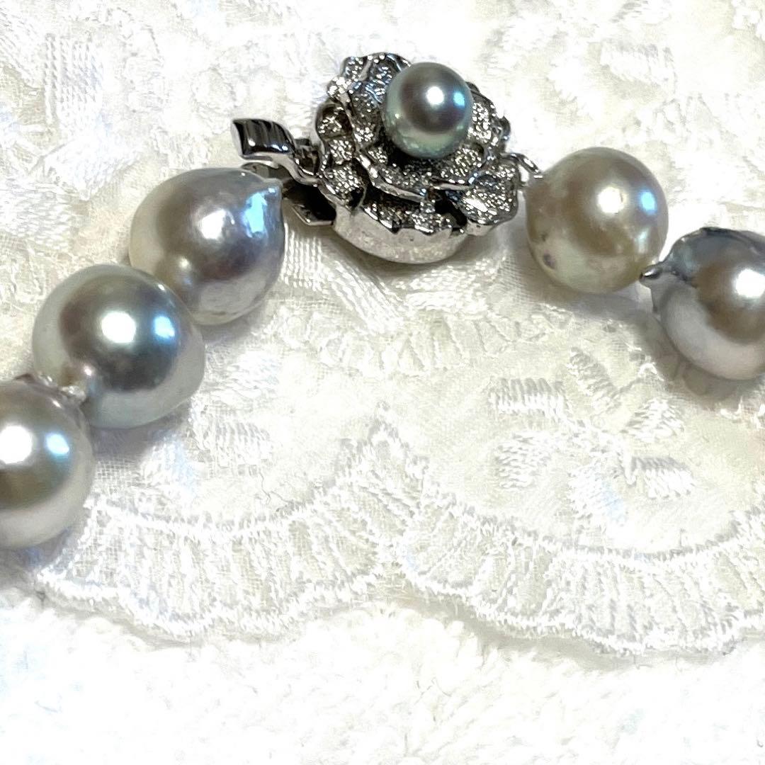 High-quality Akoya baroque pearl in blue-gray color measuring 9.5 to 9 mm with certificate