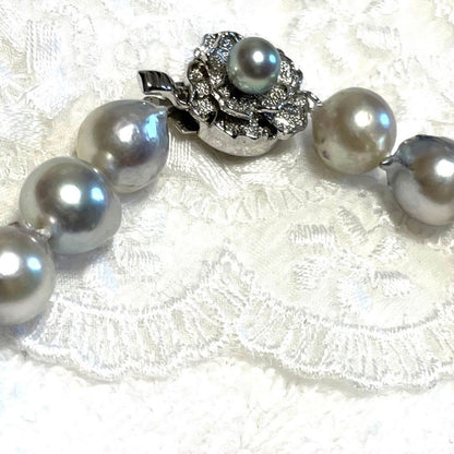 High-quality Akoya baroque pearl in blue-gray color measuring 9.5 to 9 mm with certificate