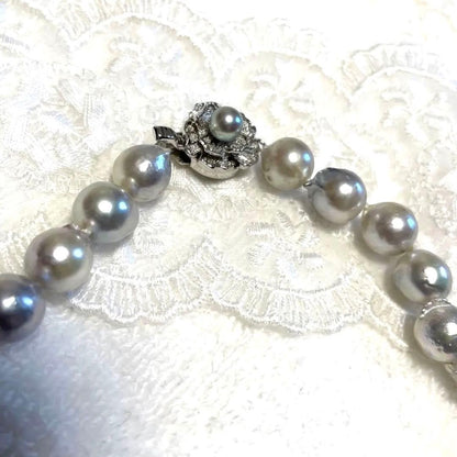 High-quality Akoya baroque pearl in blue-gray color measuring 9.5 to 9 mm with certificate