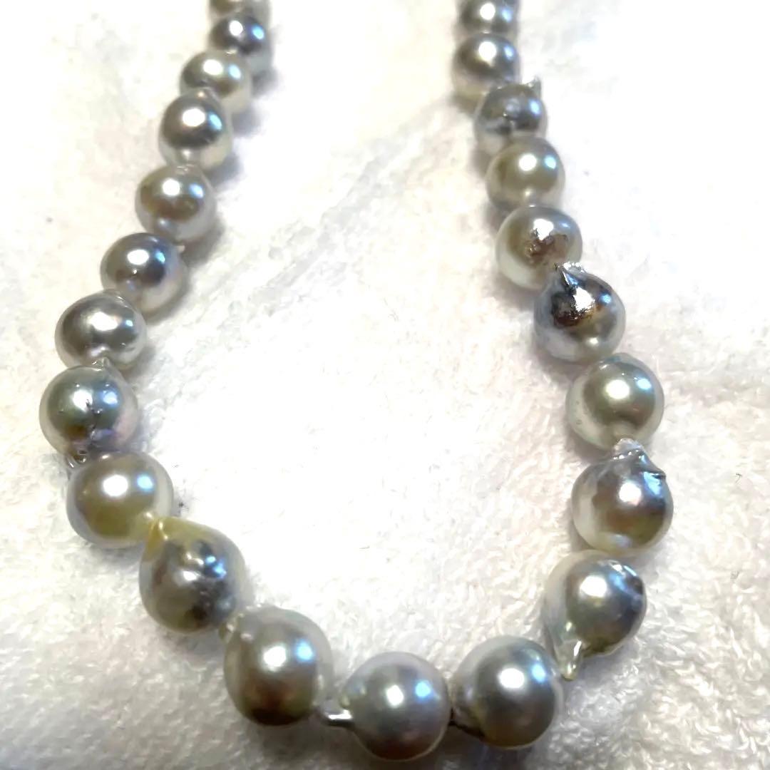 High-quality Akoya baroque pearl in blue-gray color measuring 9.5 to 9 mm with certificate